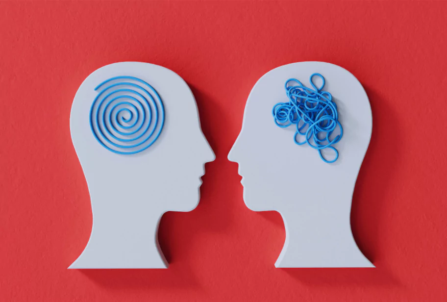 Two white silhouette heads on a red background; one with a calm blue spiral, the other with tangled lines, symbolizing the mental shifts in learning Spanish through mistakes.