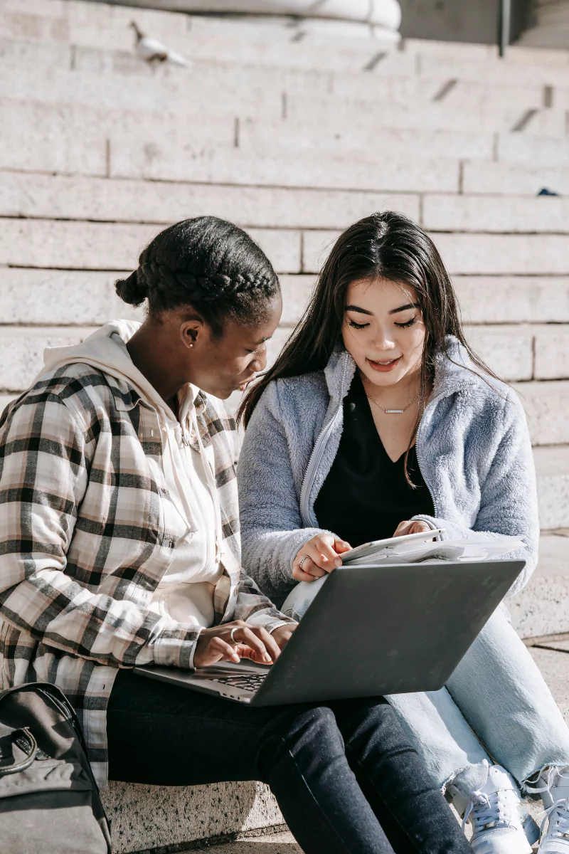 Two students enjoying an online Spanish lesson.